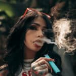 A girl vaping HHC