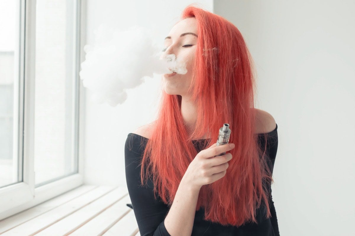 a woman vaping