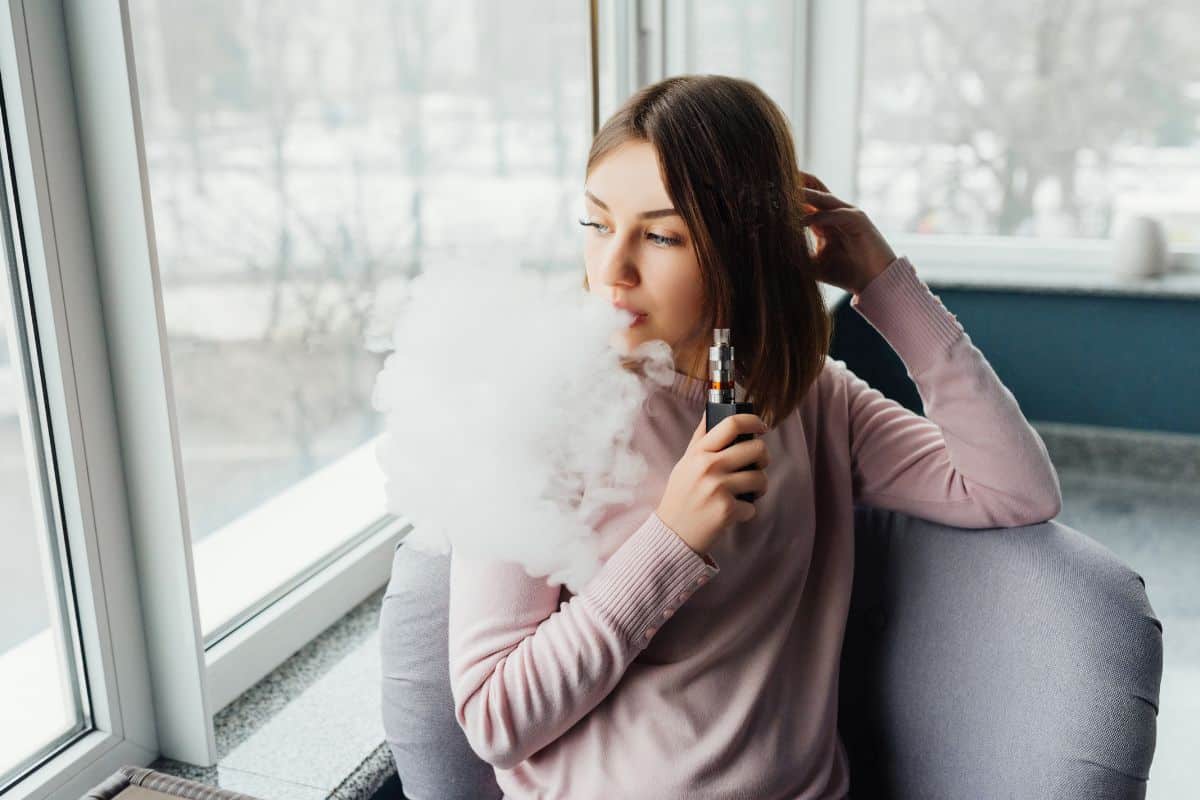 A lady vaping after a good break to increase effect of cannabis in the body.