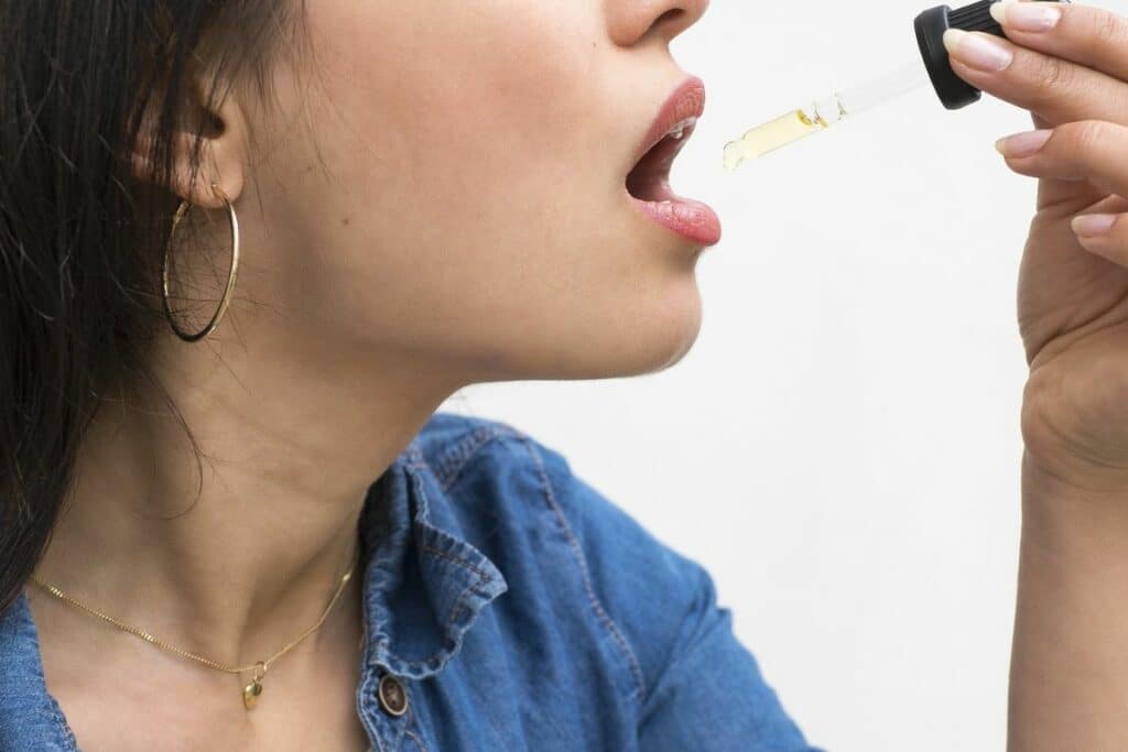 Girl consuming CBD for good digestion