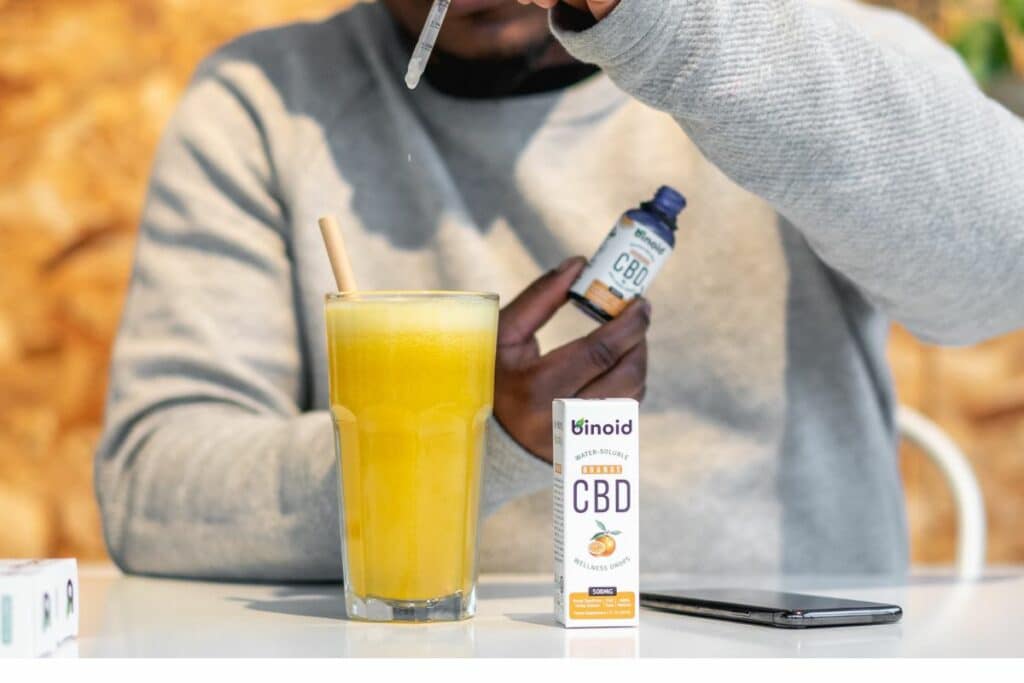 Man consuming CBD through Juice
