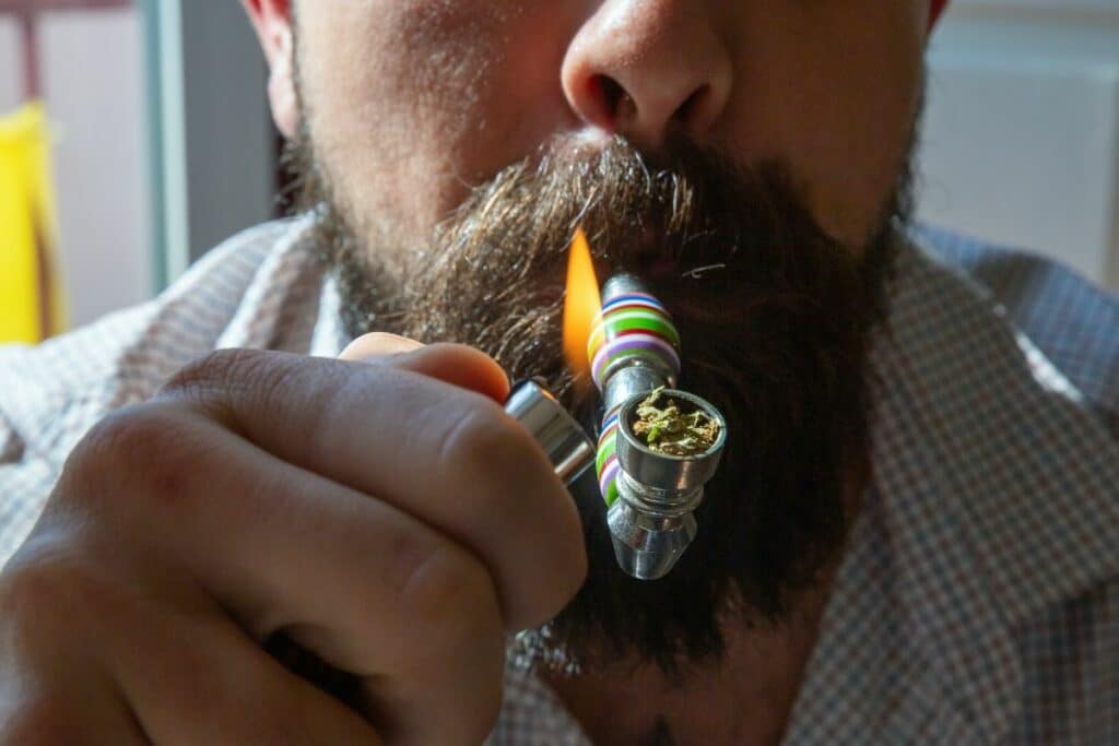 Man smoking weed pipe