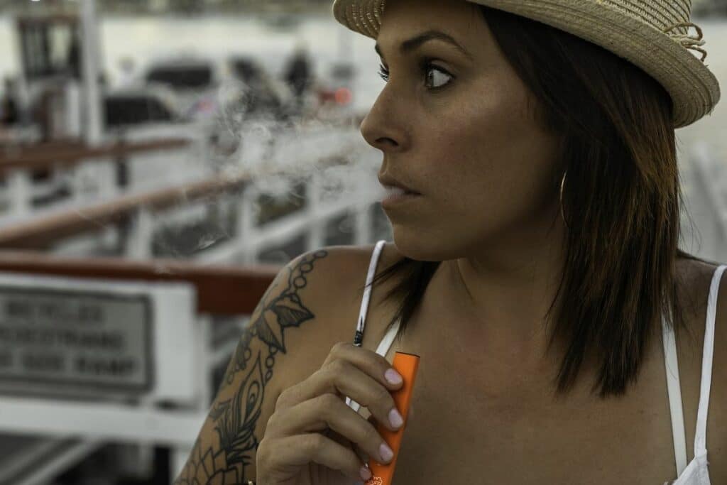 Woman smoking THC vape