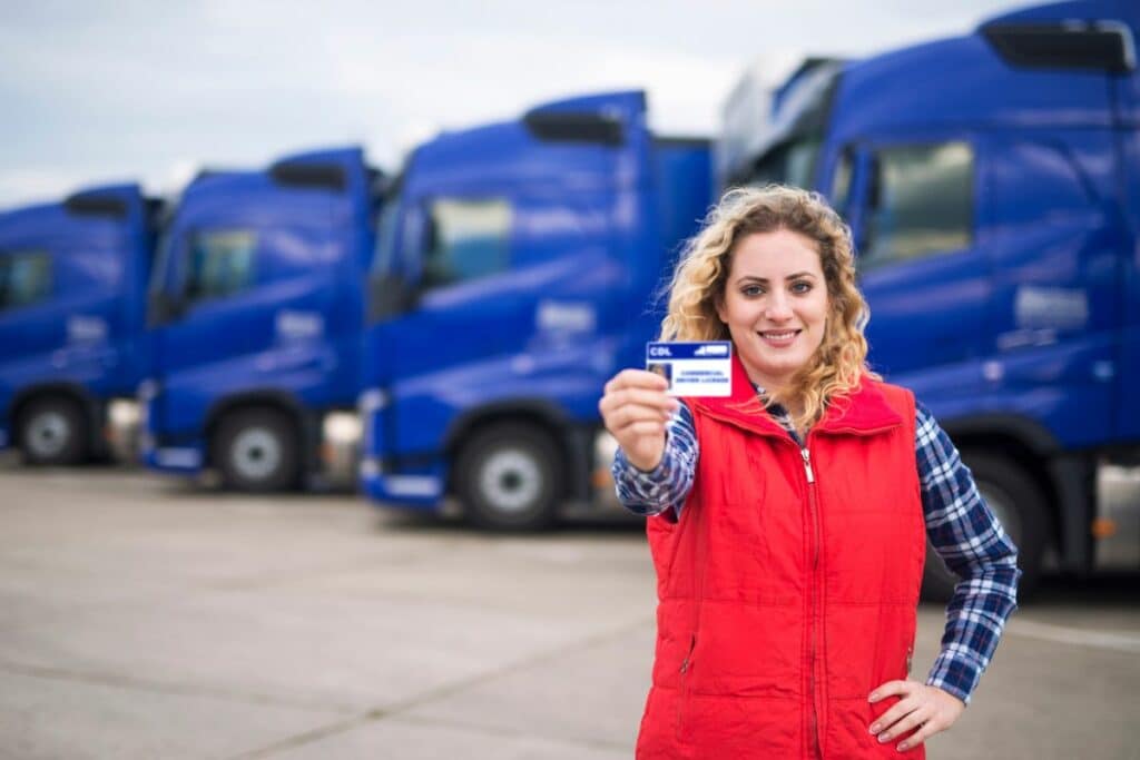 A woman holding Commercial Driving License