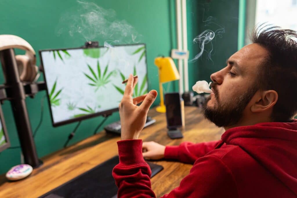 A guy smoking weed and enjoying THCA high