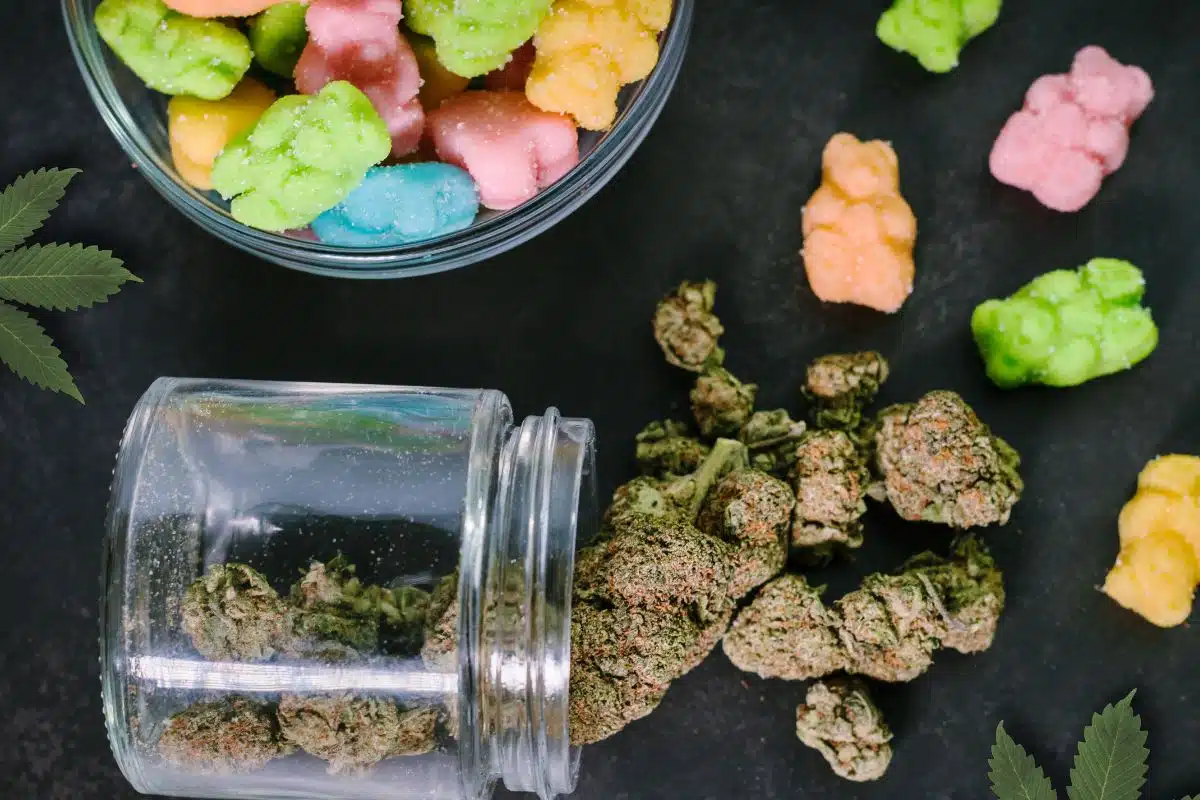 Gummy bears and cbd stored in a glass jar.