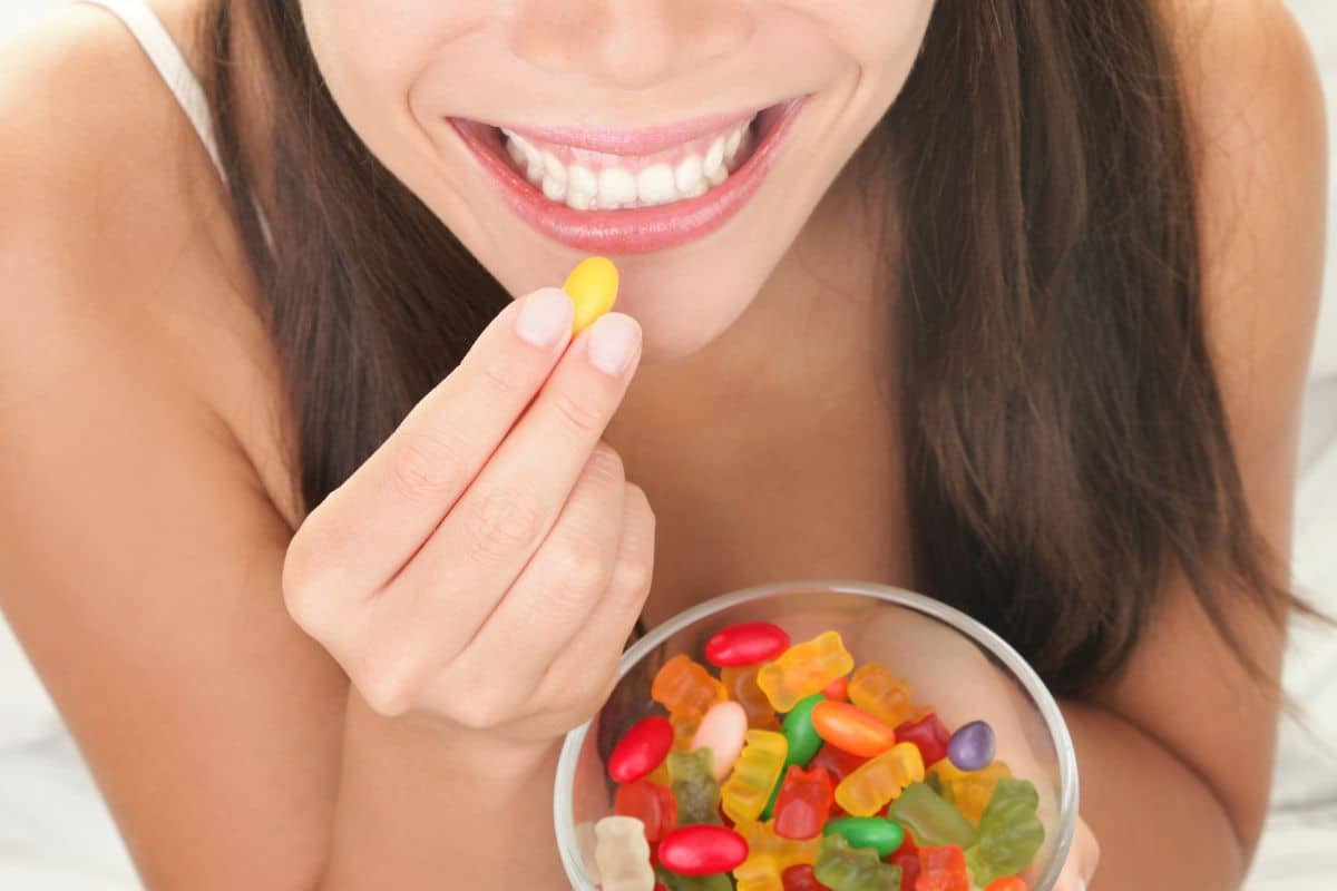 A lady consuming indica strain gummies