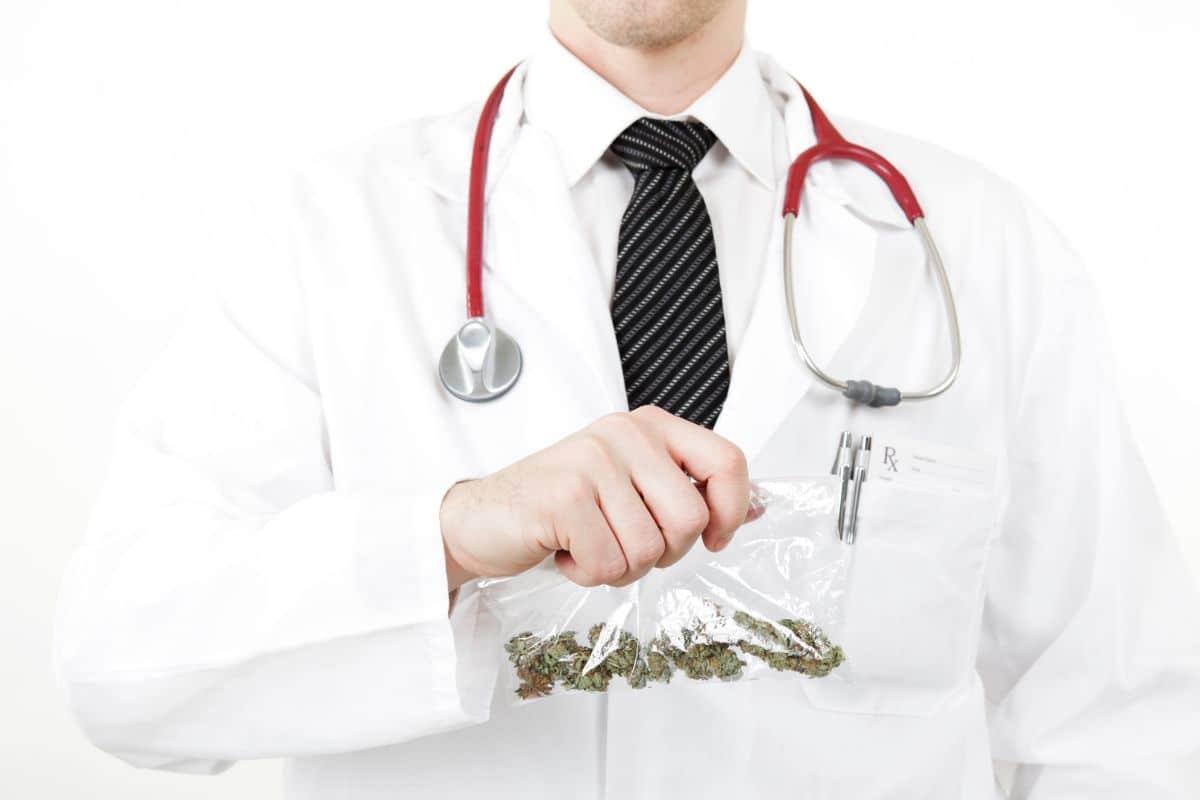 Doctor holding a packet of thc product in hand 