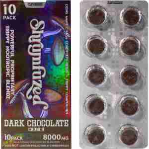 A foil pack with ten dark chocolate crunch pieces next to a colorful box labeled "Shrumfuzed Nootropic Trippy Psychedelic Mushroom Chocolate 10pc," containing 8000mg of a trippy nootropic blend, legal under state law, and free of psilocybin or psychedelic mushrooms.