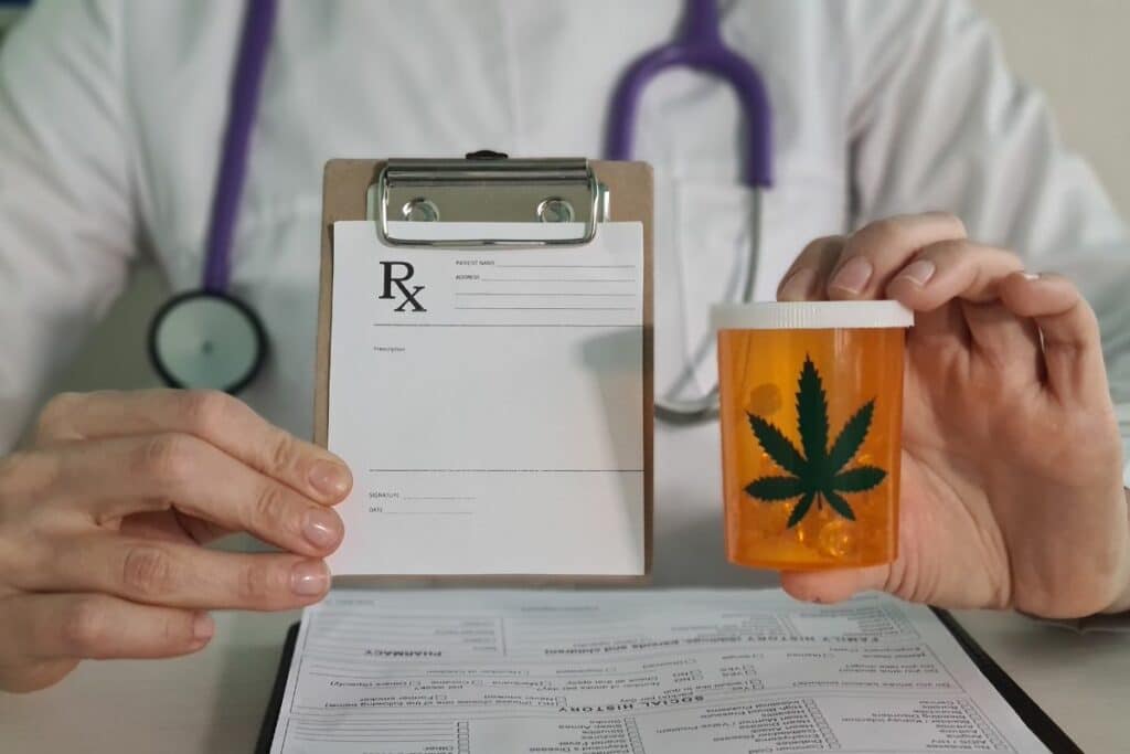 Doctor giving patient prescription for marijuana