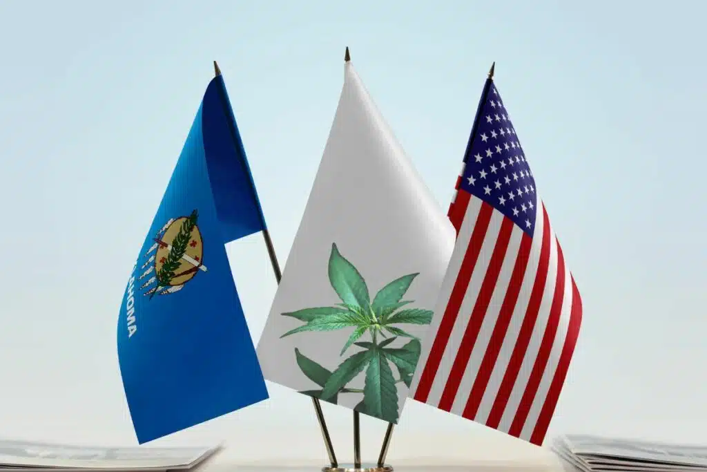 Two American flags and a marijuana leaf on a table in Oklahoma.