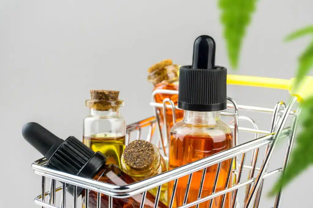 Shop for CBD oil bottles in a shopping cart, available in Oklahoma.