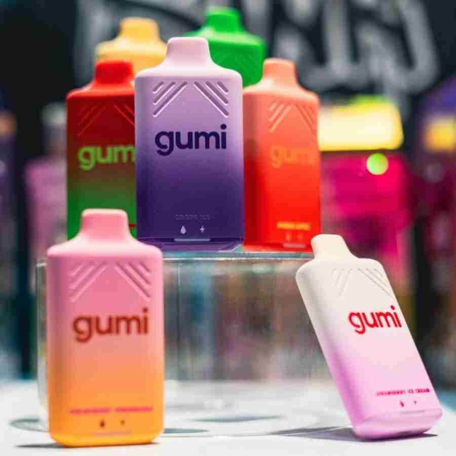 A group of colorful Gumi Bar 8000 Puffs 5% Disposable Vapes bottles with the word gummy on them.