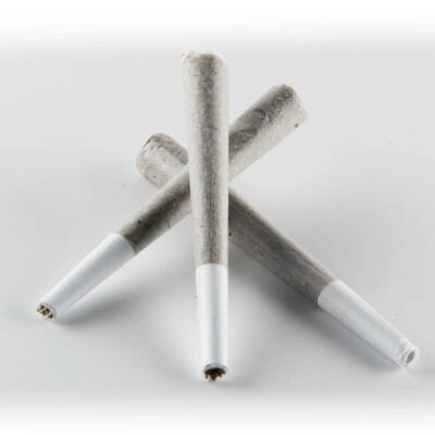 Three white and gray Elyxr LA THCa Joint 1g sticks on a white surface.