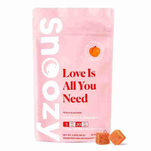 A vegan pink bag adorned with Snoozy Vegan THC Gummies 20pc.