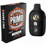 A black vaping device labeled "PRIMO" stands next to its packaging. The box features the brand "Half Bak'd" and lists product details, including "2g THCP Disposable" and "Sativa Fruit Funk.