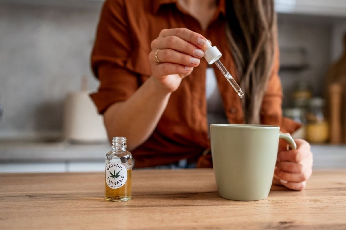 A person is consuming THC oil