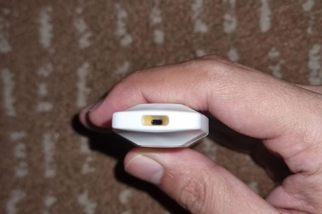 A person showing his leaking Cake disposable vape