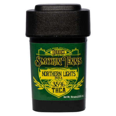 A sleek black container with a bold green label reads Smokin Tenns and Maui Wowie, showcasing its 35% THCA premium indoor flower content. Clearly labeled as 1 Gram, it has a net weight of 16 grams (0.35 oz.).