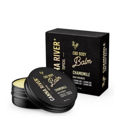 A sleek black tin labeled CANNA RIVER CBD Body Balm - Chamomile rests before its matching box. The packaging emphasizes the balms potency, boasting 1250mg each of Broad Spectrum CBD, CBG, and CBN.