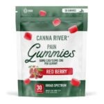 The Canna River Pain Gummies packaging features a green and white bag adorned with red berry and pomegranate illustrations. The label declares “50mg CBD/50mg CBG per gummy” in bold, emphasizing its broad spectrum benefits. Each pack contains 30 Red Berry-flavored gummies, designed for adult use only.