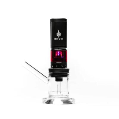 The sleek Hitoki Saber Laser Bubbler Kit, in black and red, stands on a clear glass base with a horizontal glass tube, showcasing its modern and innovative cylindrical design.