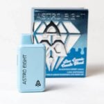 Blue vape device with Astro Eight logo and text in black, positioned in front of its packaging. The packaging features a geometric design in shades of blue and white, with additional branding and text visible.