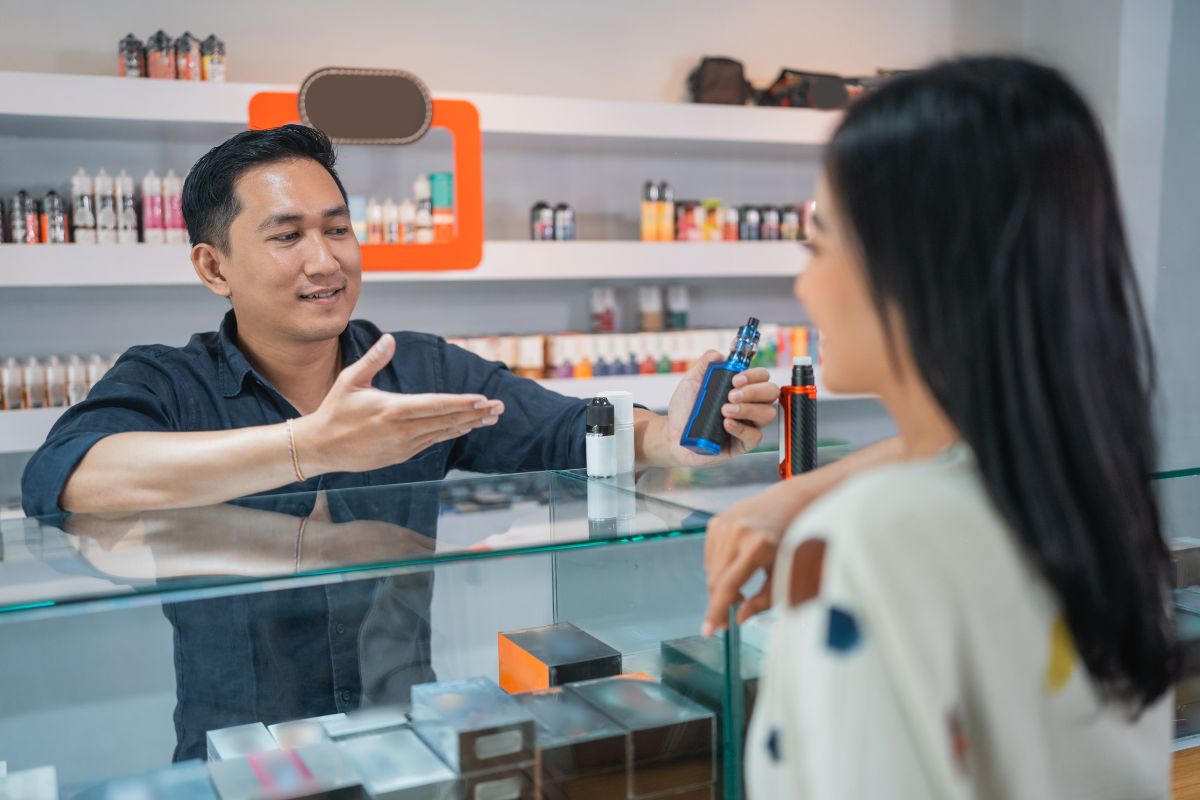 A lady buying Raz vapes from a certified shop