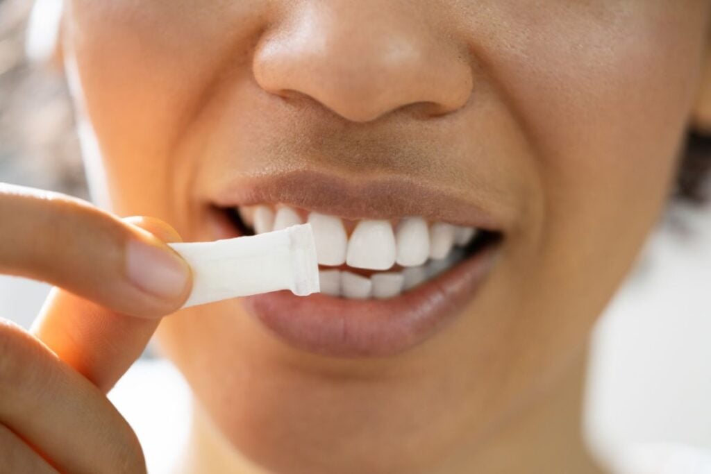 A lady consuming zyn nicotine pouches