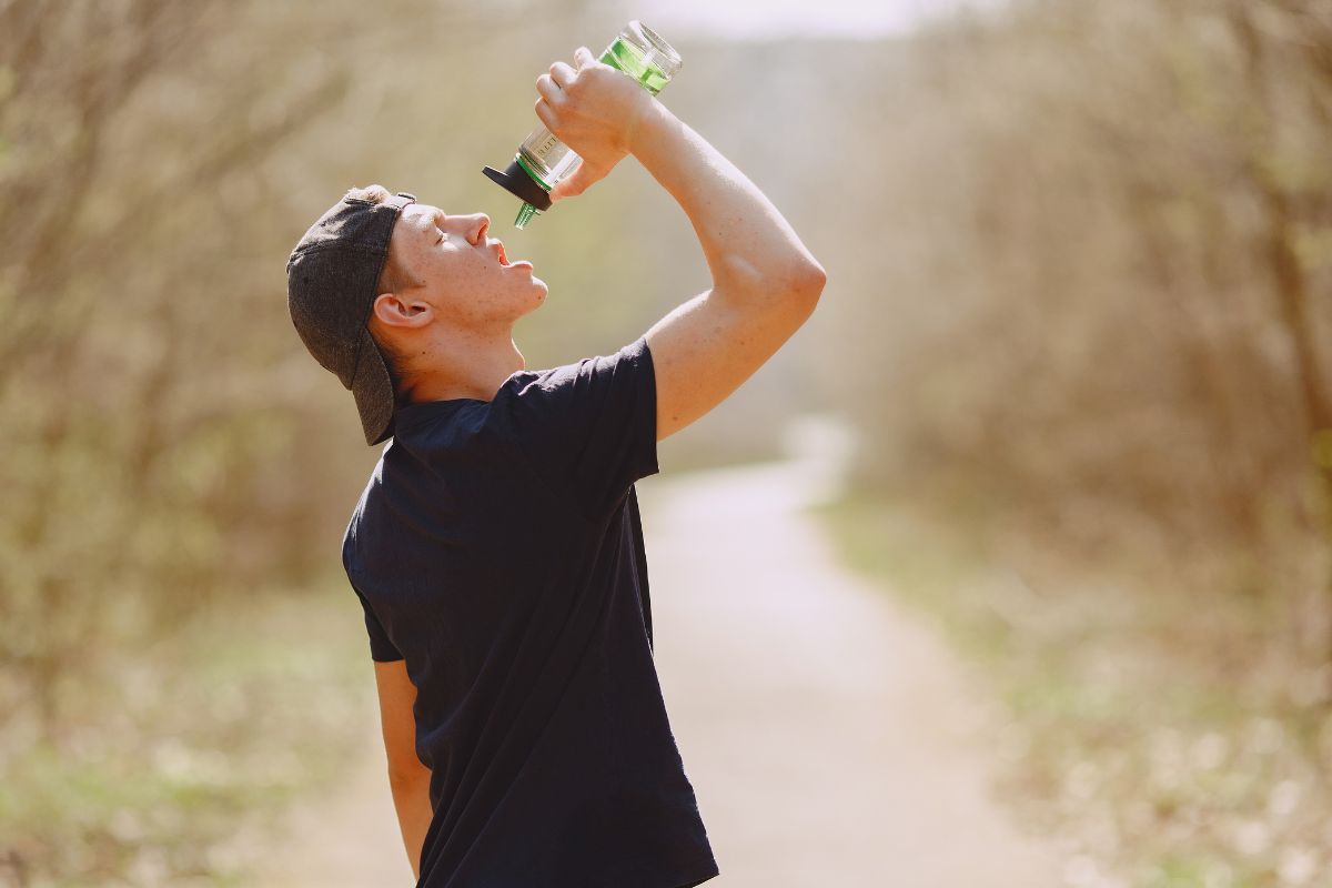 A person drinking water and doing exercise to flush out thca and other cart's  cannabinoids from the body