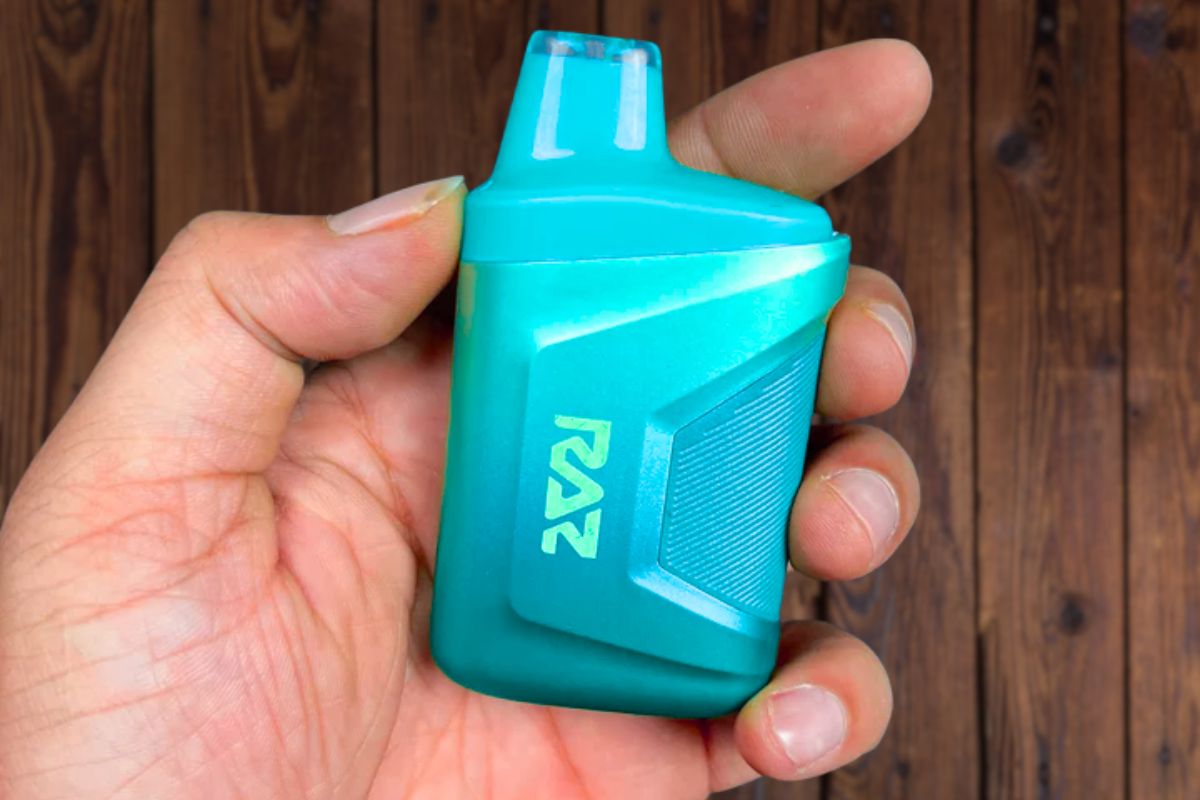 A person holding the best Raz vape flavor