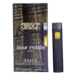 Box and vape pen for BRIXZ NYC Bespoke THCP Disposable 2g in Sour Pebbs Sativa. The box has a textured design, and the sleek black pen includes a unique yellow-tinted window.
