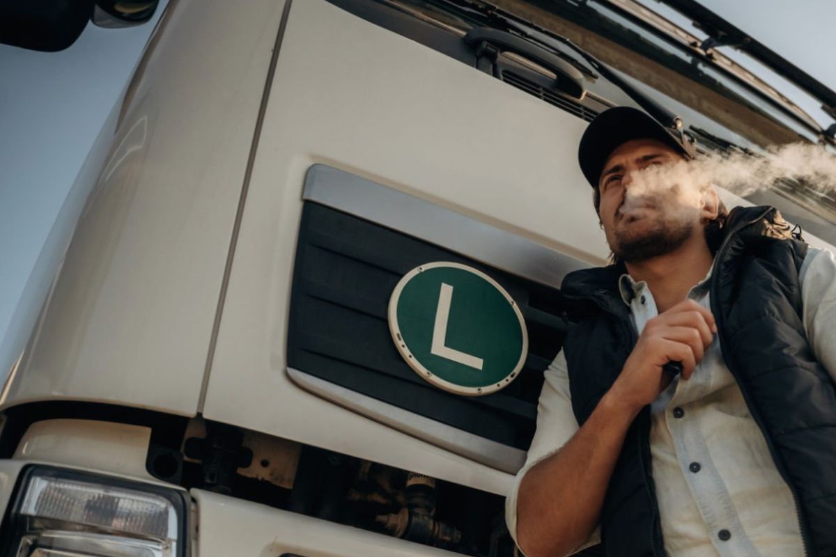 A truck driver using a CBD vape pen
