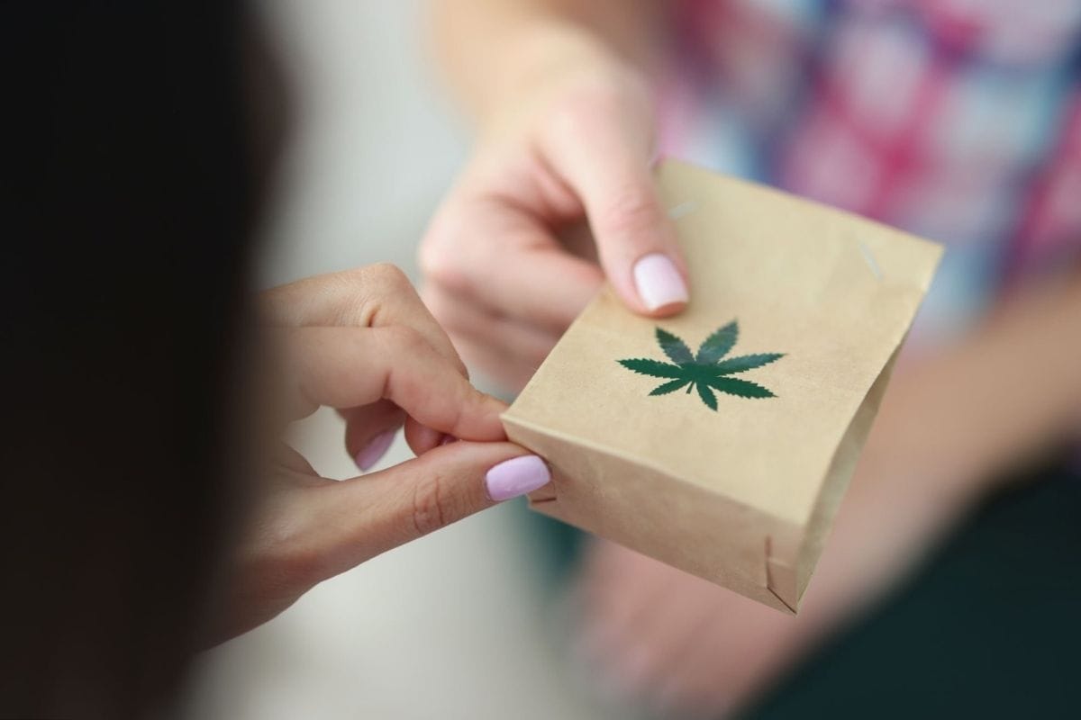 A lady is receiving THCA products at her home that she bought online