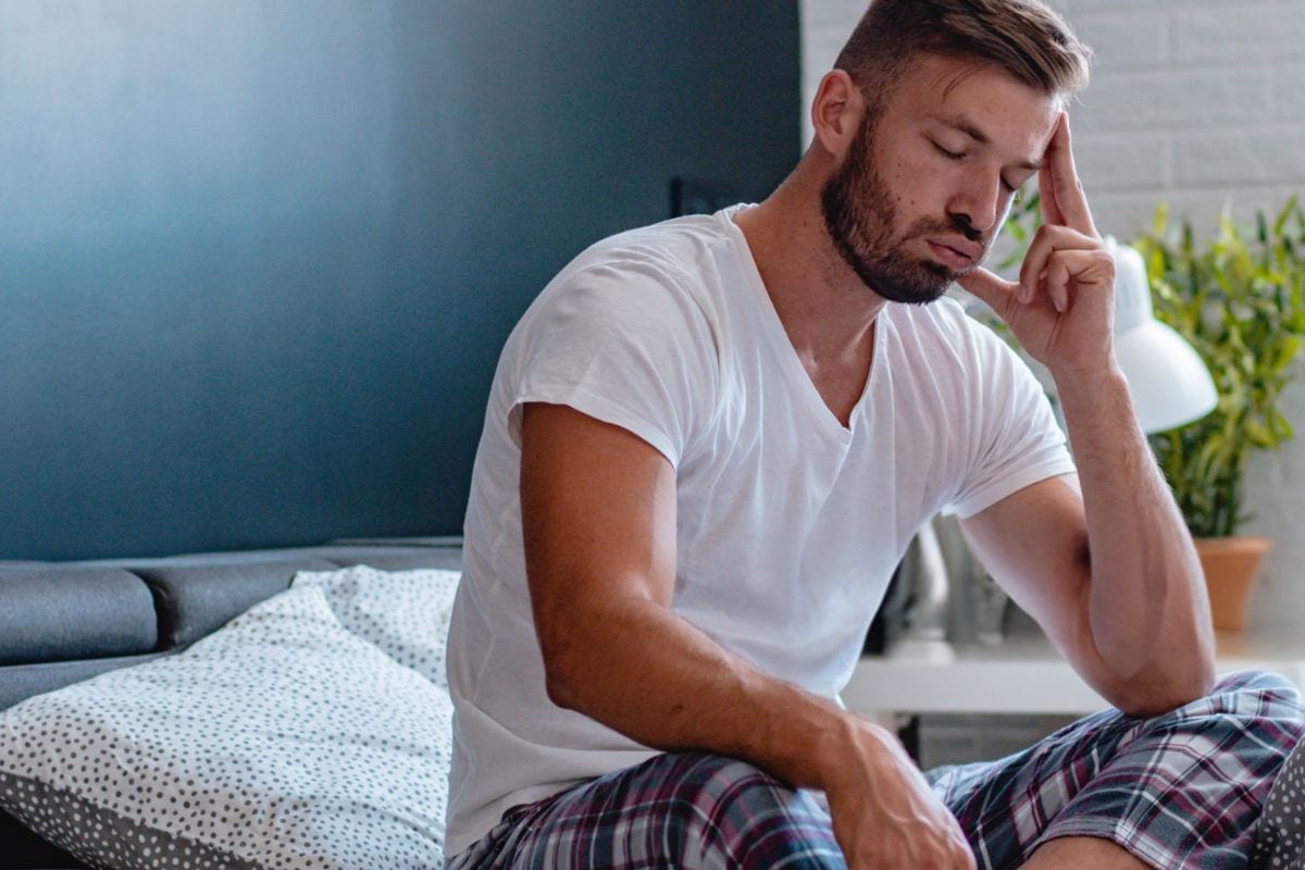 A person experiencing a hangover after eating too many Delta-9 gummies