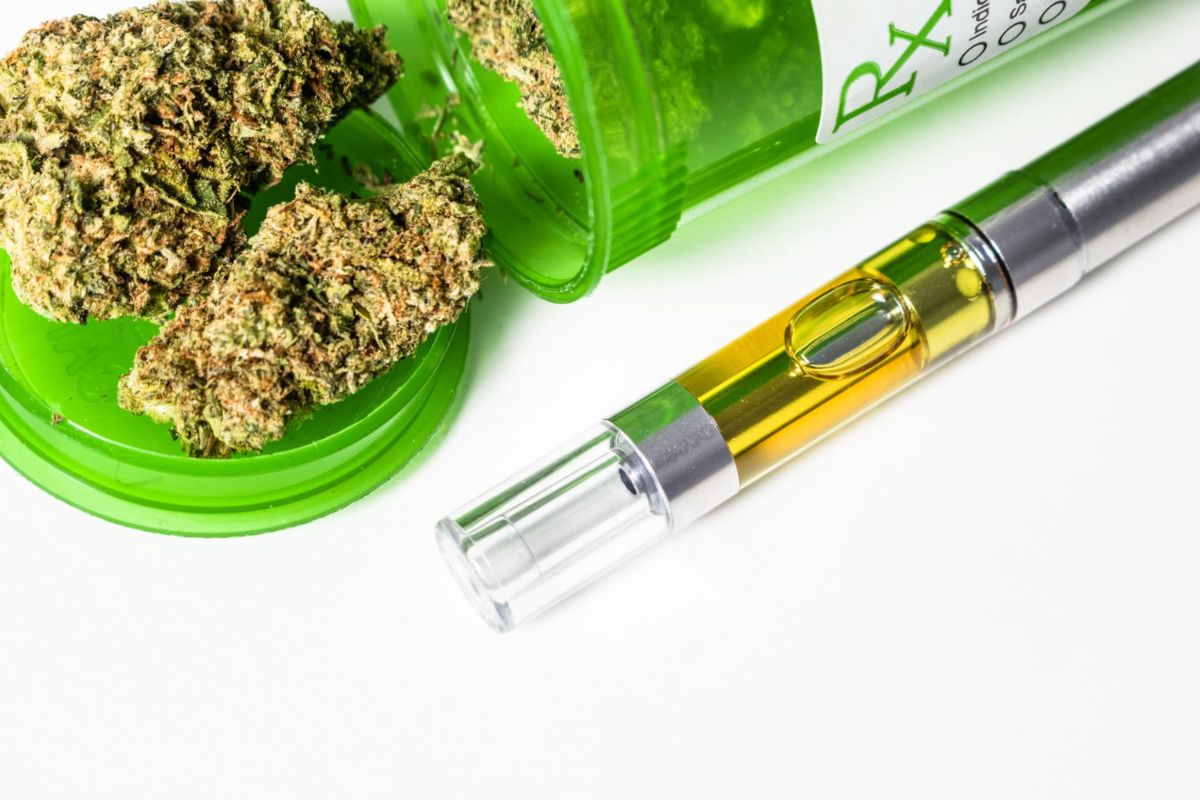 A prescribed vape cartridge and cannabis flower are kept together