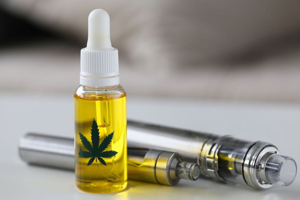 Cannabis vape oil kept together with vape pens